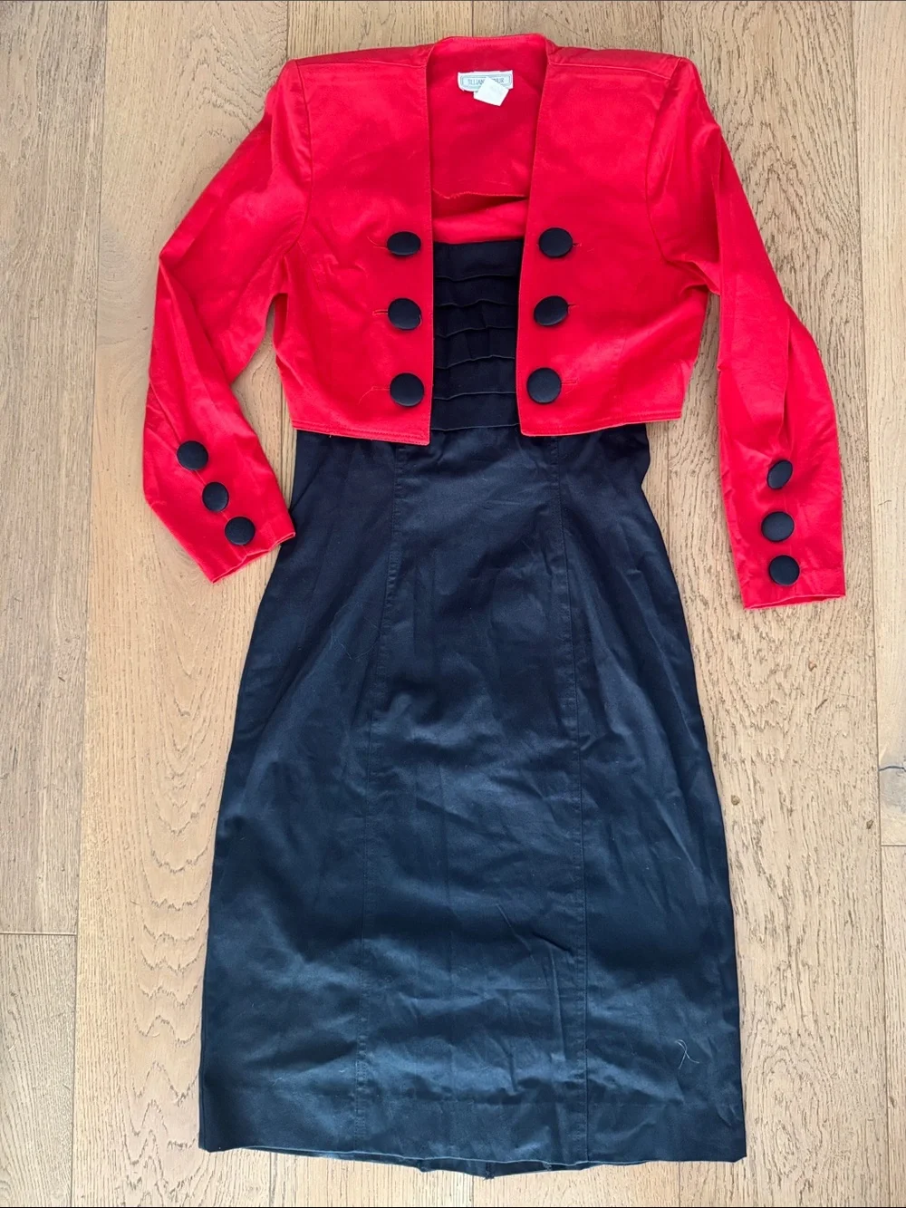 Jillian Arthur 1990s black strapless dress paired with a red bolero crop blazer